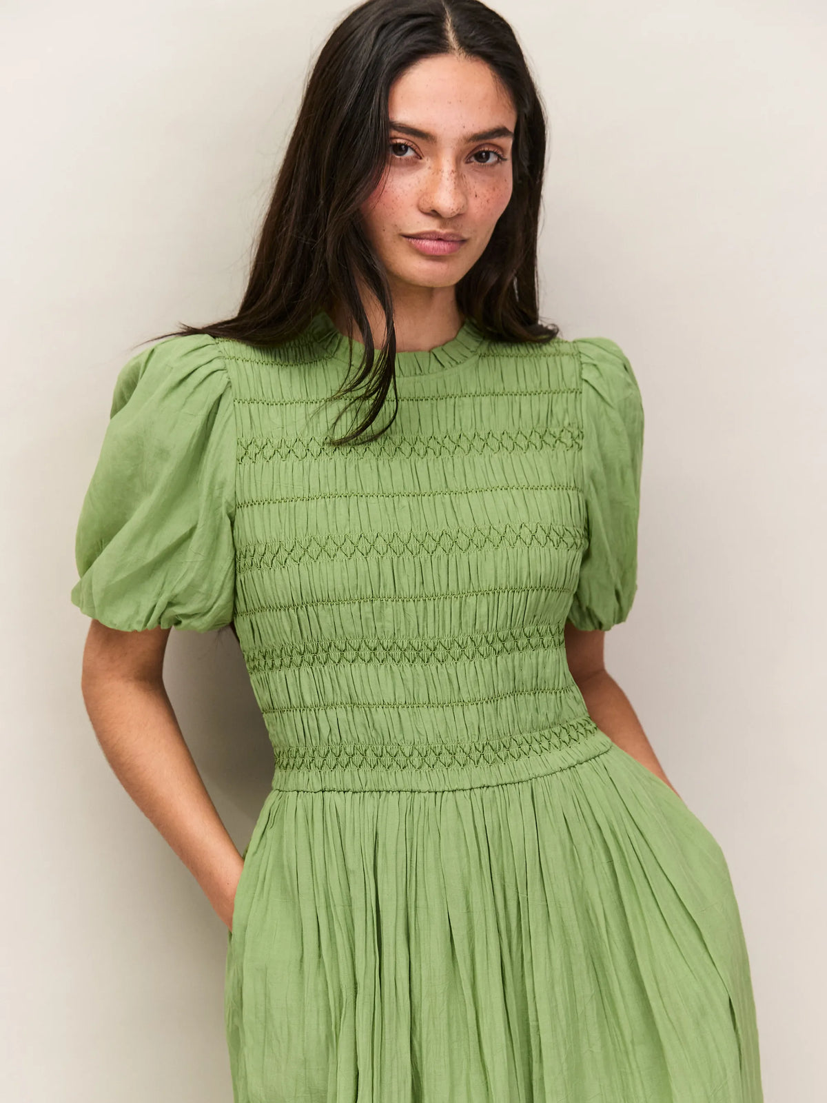 Soft green cotton dress with shirred waist and short puff sleeves