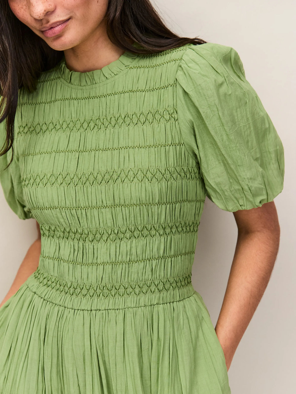 Green cotton mid length dress with fitted shirred bodice