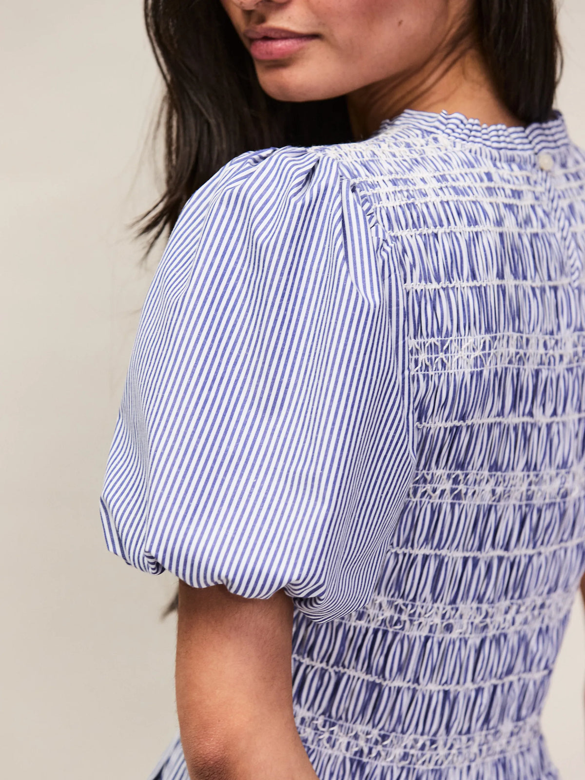 Striped blue midi dress with puff sleeves and gathered skirt