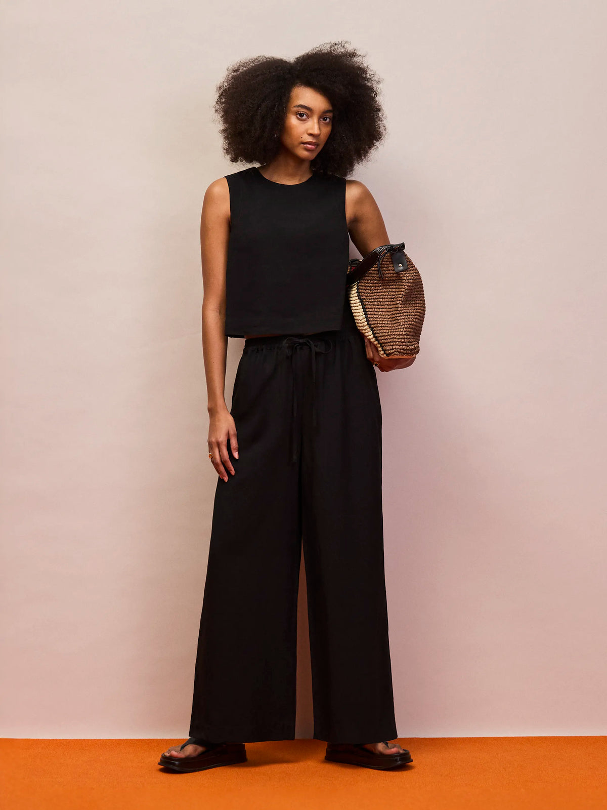 Black linen blend shell top with open twist back