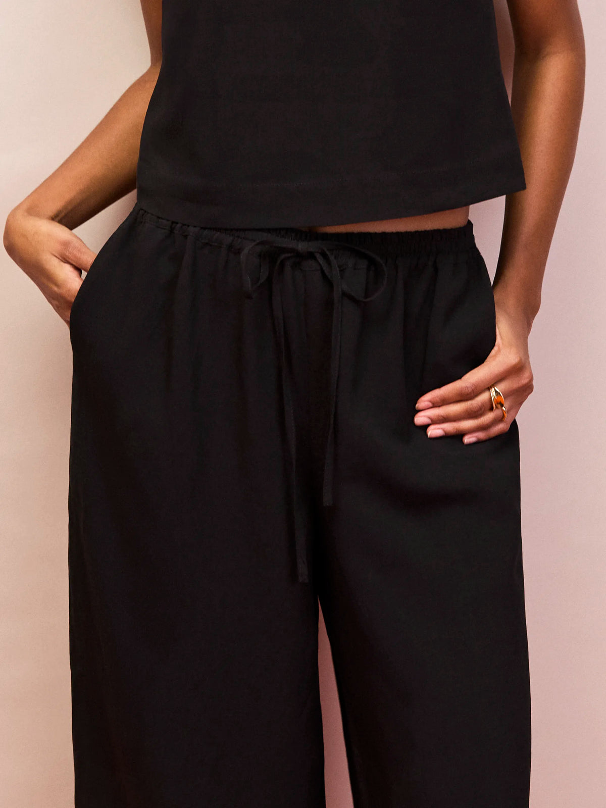 Black wide leg drawstring trousers in breathable linen blend fabric