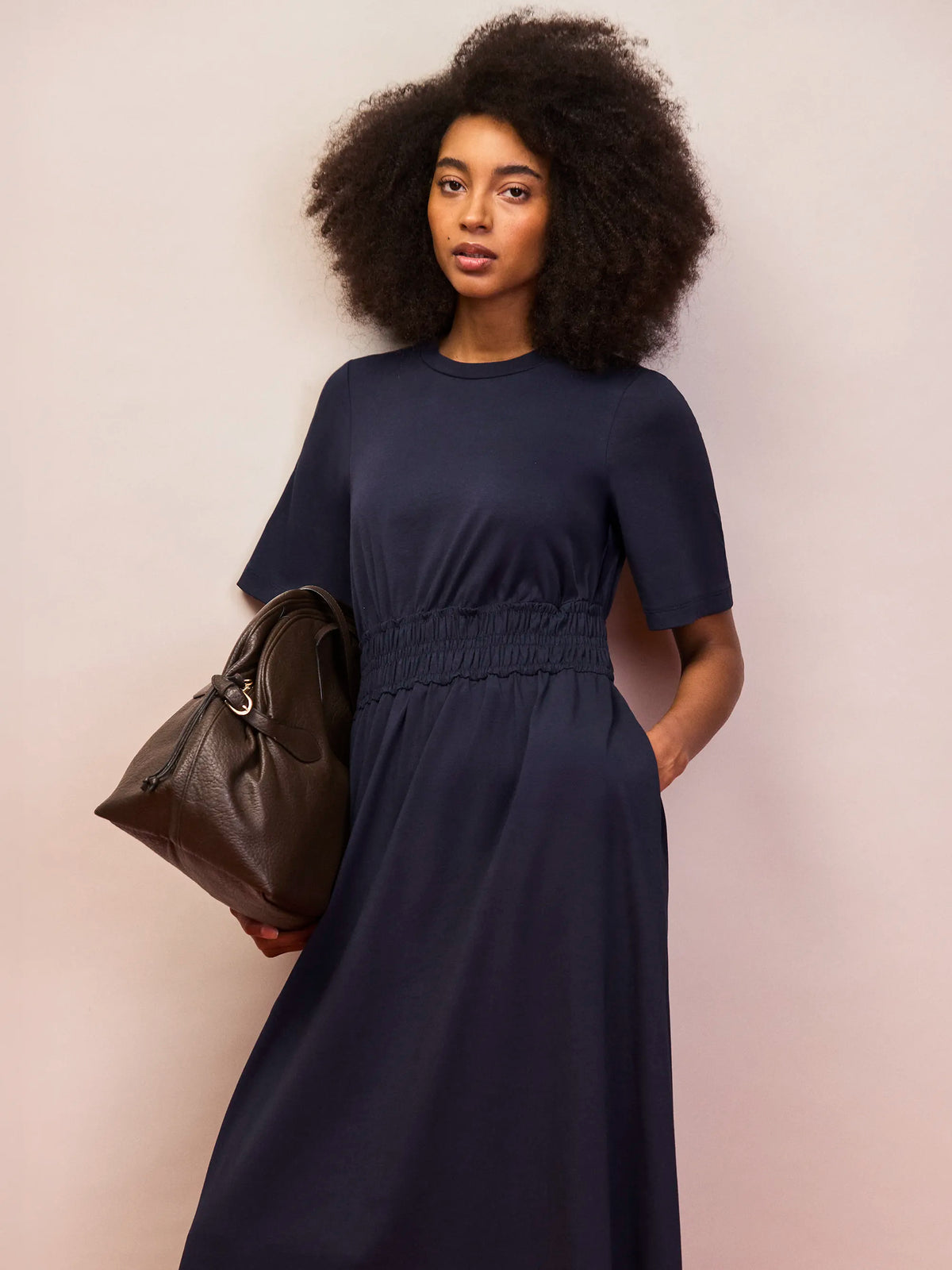 Women’s navy elasticated waist dress with crew neckline and flowing skirt