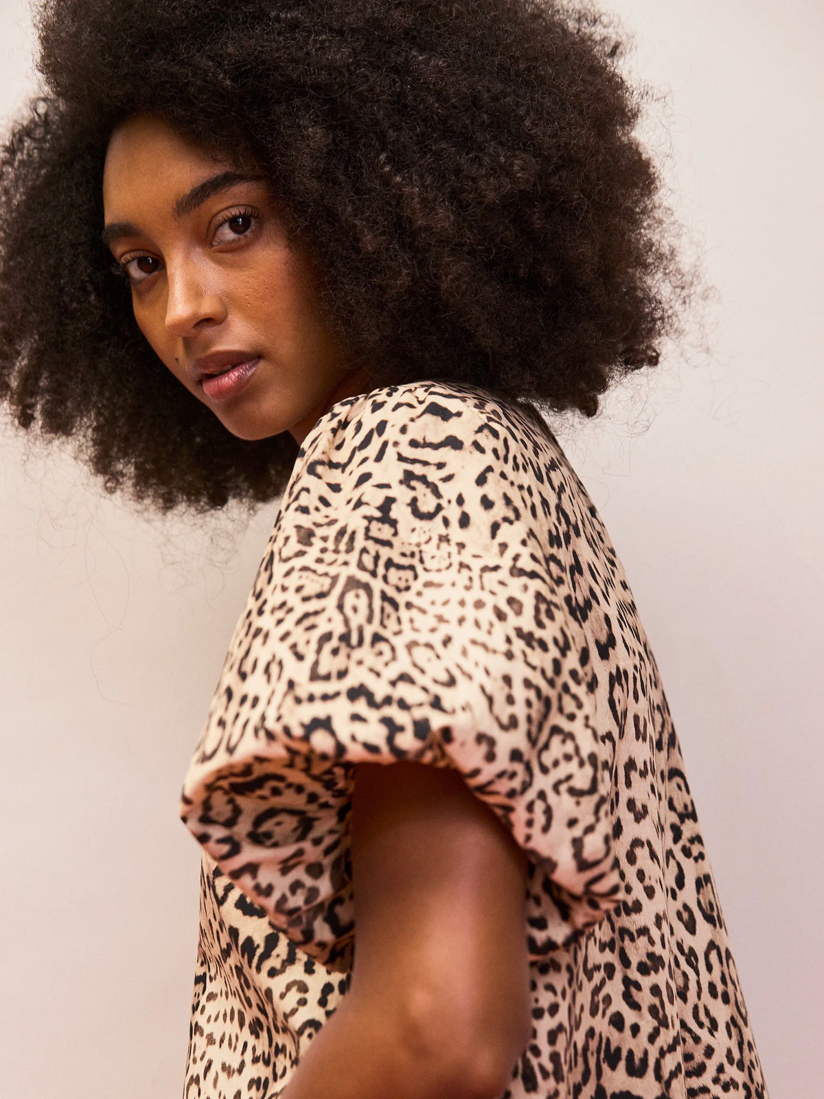 Women’s leopard print short dress with CB keyhole button fastening and puff sleeves