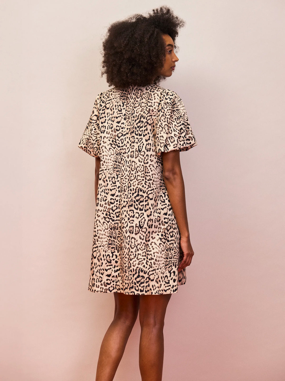 Animal print short length dress with puff sleeves and hidden side pockets