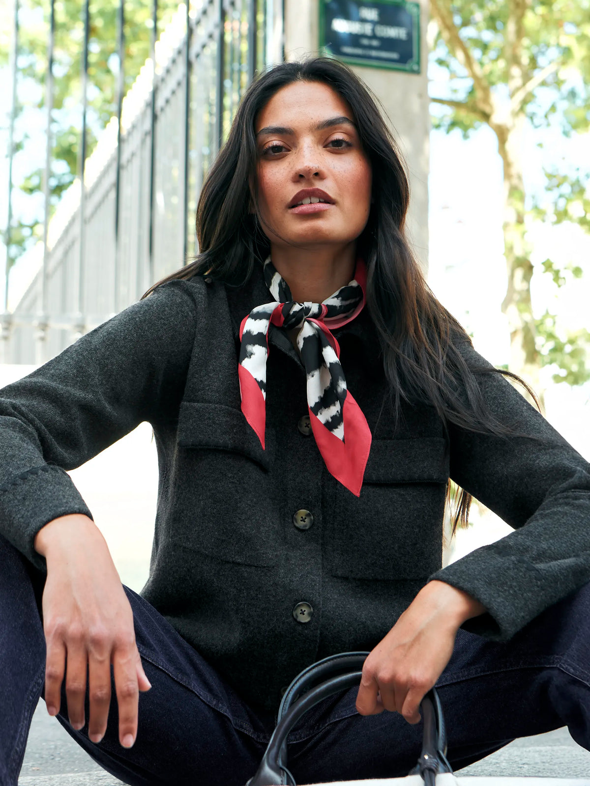 Charcoal wool-blend knit jacket with button front and patch pockets.