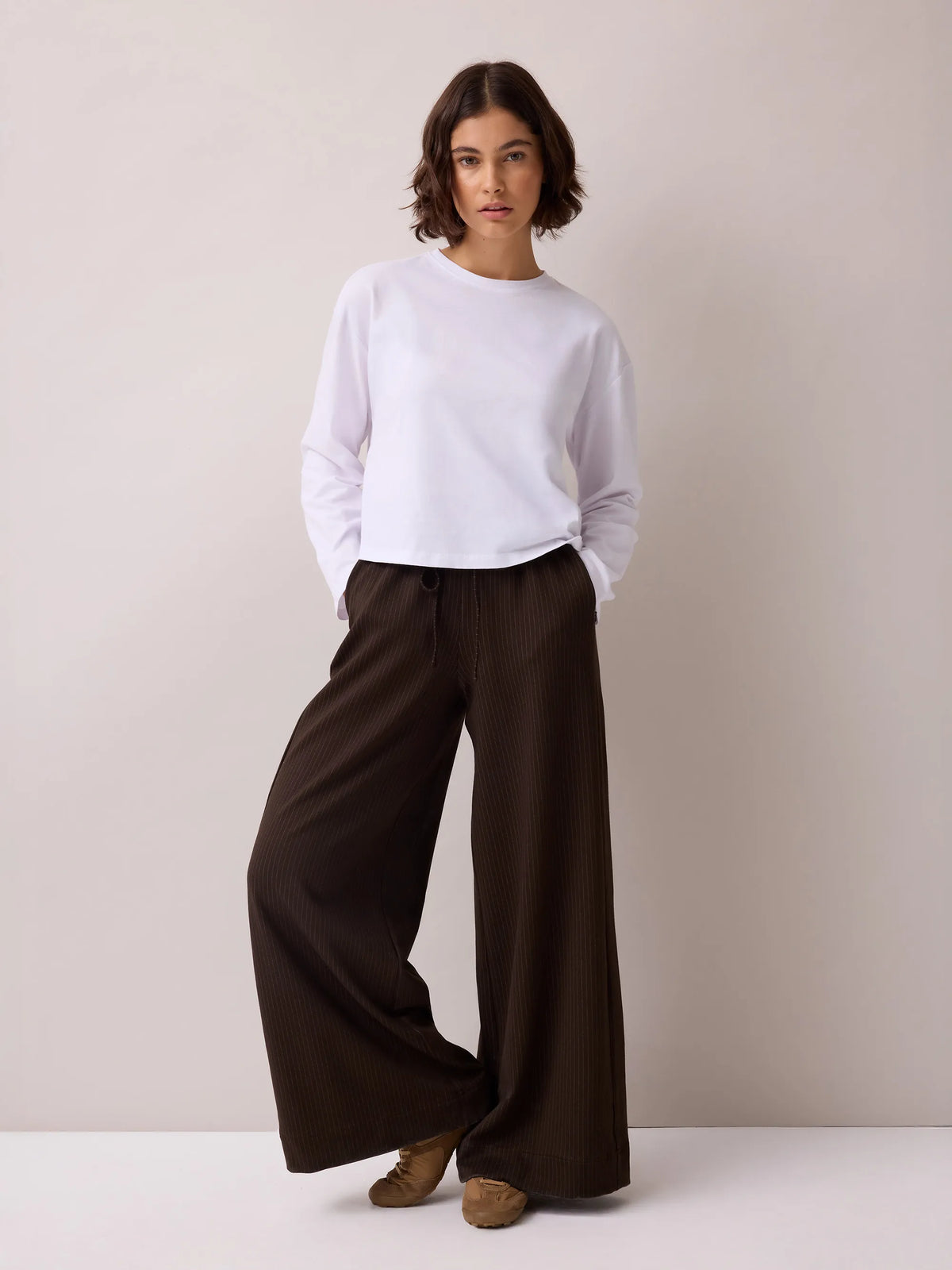 Petite brown pinstripe wide leg joggers.