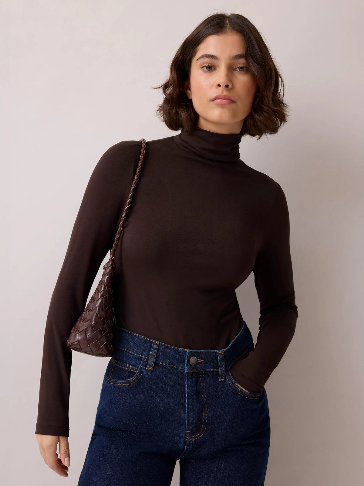 Brown cotton blend roll neck top.