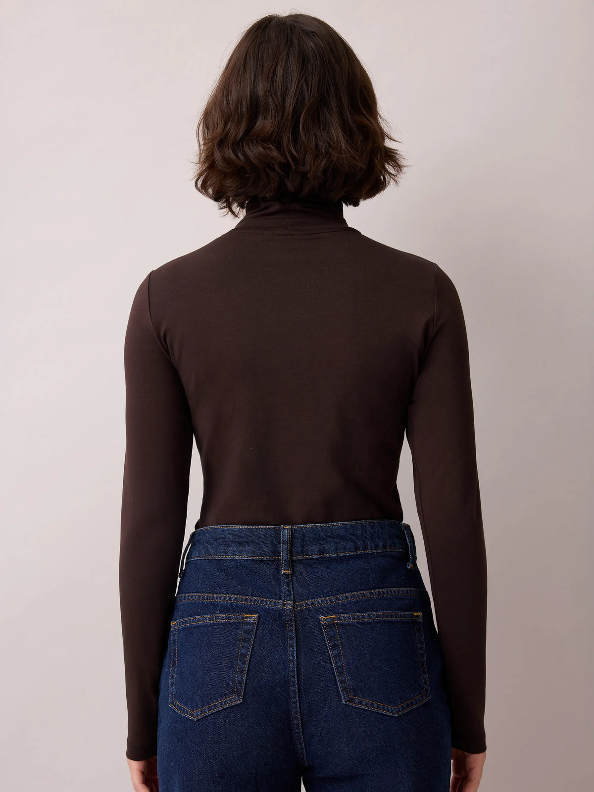 Brown cotton blend roll neck top.